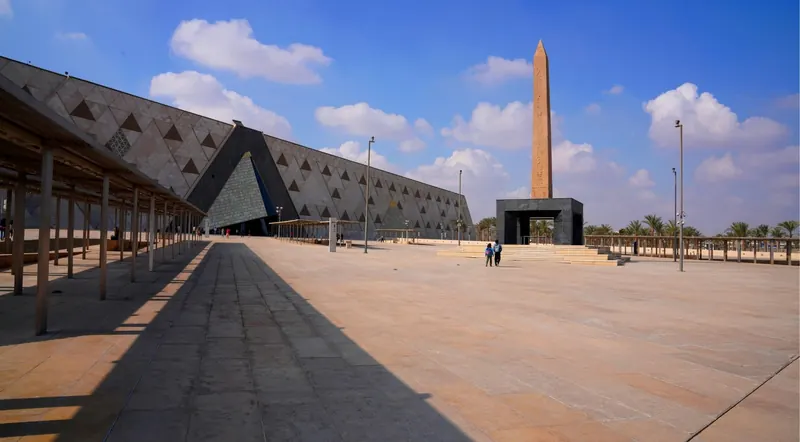 Exterior of the Grand Egyptian Museum with obelisk in the plaza